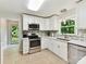 Modern kitchen with stainless appliances and white cabinetry at 13617 Lake Bluff Dr, Matthews, NC 28105