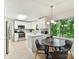 Open kitchen with stainless appliances and a breakfast nook area at 13617 Lake Bluff Dr, Matthews, NC 28105