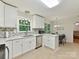 Updated kitchen with stainless appliances, stone countertops, and tile backsplash at 13617 Lake Bluff Dr, Matthews, NC 28105