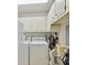 Practical laundry room with washer, dryer, cabinets, and ample storage space at 13617 Lake Bluff Dr, Matthews, NC 28105