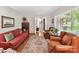 Cozy living room with hardwood floors, large windows, and comfortable seating, creating a relaxing ambiance at 13617 Lake Bluff Dr, Matthews, NC 28105