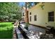 An inviting backyard featuring a charming patio, a lush lawn, and a beautiful two-story home exterior at 15400 Groveland St, Huntersville, NC 28078