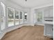 Sun-drenched breakfast nook with large windows and access to deck or yard at 15400 Groveland St, Huntersville, NC 28078