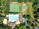 Aerial shot of a well-equipped community recreation area including a pool, tennis court, and basketball court at 15400 Groveland St, Huntersville, NC 28078