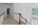 Hallway leading to the front door and overlooking the downstairs living area at 15400 Groveland St, Huntersville, NC 28078