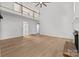 Bright living room features a soaring ceiling, fireplace, and light wood floors at 15400 Groveland St, Huntersville, NC 28078