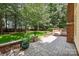 Brick-paved patio next to a landscaped backyard at 15400 Groveland St, Huntersville, NC 28078