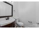 Modern powder room with a stylish vanity, mirror, and updated fixtures at 15400 Groveland St, Huntersville, NC 28078