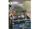 Club Car golf cart under a canopy with seating and steering wheel at 155 Indian Harbor Trl # E243, Mount Gilead, NC 27306