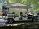 Golf cart in front of outbuilding with space for six at 155 Indian Harbor Trl # E243, Mount Gilead, NC 27306