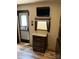 Interior view showcasing a TV, window, and dresser with three drawers at 155 Indian Harbor Trl # E243, Mount Gilead, NC 27306