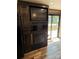 The kitchen area features dark cabinetry and a black appliance package at 155 Indian Harbor Trl # E243, Mount Gilead, NC 27306