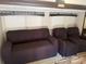 Relaxing living area with a brown sofa and chairs with great natural light at 155 Indian Harbor Trl # E243, Mount Gilead, NC 27306