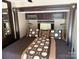 A bedroom with coordinating brown bedding and built-in storage at 155 Indian Harbor Trl # E243, Mount Gilead, NC 27306