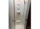 Clean white tiled shower with seat and adjustable shower head at 155 Indian Harbor Trl # E243, Mount Gilead, NC 27306