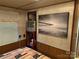 Bedroom with wood paneling and an entertainment center and a picture of a pier at 160/162 Arrowood Trl # F28/F29, Mount Gilead, NC 27306