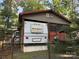 Rear view of home exterior and boat, highlighting the ample space and recreational opportunities at 160/162 Arrowood Trl # F28/F29, Mount Gilead, NC 27306