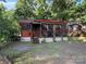 Charming exterior featuring a screened-in front porch, providing a cozy outdoor living space at 160/162 Arrowood Trl # F28/F29, Mount Gilead, NC 27306