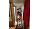 Hallway leads to the bathroom, featuring a long decorative rug and wood paneling at 160/162 Arrowood Trl # F28/F29, Mount Gilead, NC 27306