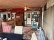 Cozy sunroom with outdoor rug and decorative elements attached to the sides of mobile home trailers at 160/162 Arrowood Trl # F28/F29, Mount Gilead, NC 27306