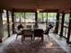 Inviting screened-in porch with ample seating and a rustic ceiling fan, perfect for entertaining at 160/162 Arrowood Trl # F28/F29, Mount Gilead, NC 27306