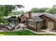 Aerial view of a well-maintained backyard, patios, green lawn, and brick home at 1695 Arden Dr, Lincolnton, NC 28092