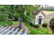Backyard view featuring a cozy cottage surrounded by lush greenery and well-maintained landscaping at 1695 Arden Dr, Lincolnton, NC 28092