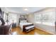 Bedroom with a dark wood bedframe, neutral walls, hardwood floors, and plenty of natural light from the windows at 1695 Arden Dr, Lincolnton, NC 28092