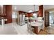 Spacious kitchen with granite countertops, stainless steel appliances, tile floors, and wooden cabinetry at 1695 Arden Dr, Lincolnton, NC 28092