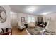 Cozy living room featuring hardwood floors, neutral walls, and bright natural lighting at 1695 Arden Dr, Lincolnton, NC 28092