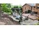 Outdoor patio area with stone base, fire pit, and ample seating perfect for entertaining at 1695 Arden Dr, Lincolnton, NC 28092