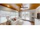 Bright sun room with wood ceilings, lots of windows, and comfortable seating at 1695 Arden Dr, Lincolnton, NC 28092