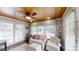 Bright sun room with wood ceilings, lots of windows, and comfortable seating at 1695 Arden Dr, Lincolnton, NC 28092
