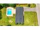 Aerial view of a home and pool, set in a well-maintained lawn and tree filled lot at 1837 6Th Nw Ave, Hickory, NC 28601