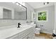 Bathroom featuring a modern sink, white cabinets, updated light fixtures, and a view of the outdoors at 1837 6Th Nw Ave, Hickory, NC 28601