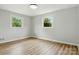 Bedroom showcasing natural light with its freshly painted neutral walls and wood flooring at 1837 6Th Nw Ave, Hickory, NC 28601