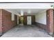 Carport featuring brick columns and an open-air design with a view to the fenced in yard at 1837 6Th Nw Ave, Hickory, NC 28601