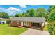 Charming one-story brick home with a well-manicured lawn and a convenient carport at 1837 6Th Nw Ave, Hickory, NC 28601