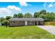 Charming single-story brick home featuring a well-manicured lawn and a convenient carport at 1837 6Th Nw Ave, Hickory, NC 28601