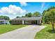 Front view of brick home showing long driveway, well-maintained lawn and a convenient carport at 1837 6Th Nw Ave, Hickory, NC 28601
