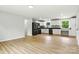 Modern kitchen with white cabinets, black countertops, sleek appliances, and bright natural lighting at 1837 6Th Nw Ave, Hickory, NC 28601