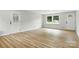 Bright living room featuring beautiful wood flooring and two entryways with natural light at 1837 6Th Nw Ave, Hickory, NC 28601