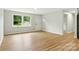 Bright living room with hardwood flooring, with natural light from a large window at 1837 6Th Nw Ave, Hickory, NC 28601