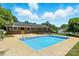 Backyard pool area with a brick house featuring access to an outdoor swimming pool at 1837 6Th Nw Ave, Hickory, NC 28601