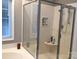Modern bathroom featuring a glass-enclosed shower and built-in shelf for toiletries at 1842 Caroline Way, Fort Mill, SC 29715