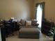 Cozy bedroom showcases a comfortable sitting area and a view of the outdoors, perfect for relaxation at 1842 Caroline Way, Fort Mill, SC 29715