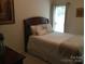 Inviting bedroom featuring a queen bed, large window, and a cozy, relaxing ambiance at 1842 Caroline Way, Fort Mill, SC 29715