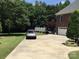 Long driveway leads to a spacious home with a side-entry garage, offering privacy and ample parking at 1842 Caroline Way, Fort Mill, SC 29715