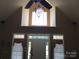 Bright Foyer with high ceilings, large windows, and decorative chandelier at 1842 Caroline Way, Fort Mill, SC 29715