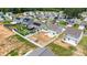 View of a neighborhood with modern homes, solar panels, and fenced yards, showcasing community living at 2011 Valdosta Way, Charlotte, NC 28215